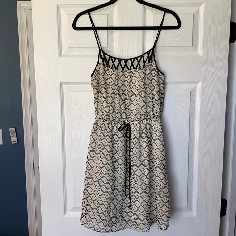 Beautiful criss cross neck black and cream dress